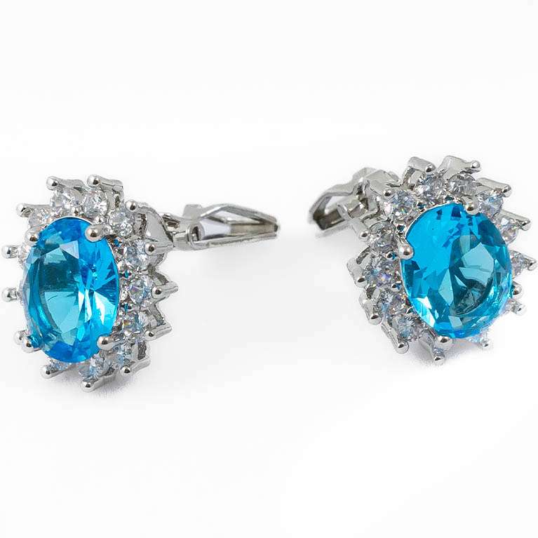 Orecchini fiore con zircone azzurro cielo e zirconi bianchi